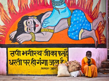 Varanasi, Hindistan'da Hindu renkli sanat tarafından oturan Hint adam