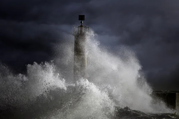 Stormy waves over lighthouse — Stock Photo, Image