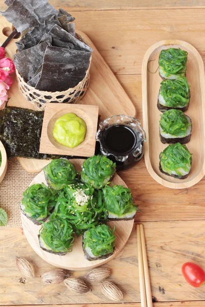 Sushi roll and seaweed salad is delicious. — Stock Photo, Image