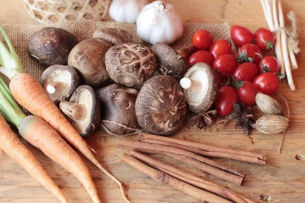 Mushrooms and vegetables on wood background. — Stock Photo, Image