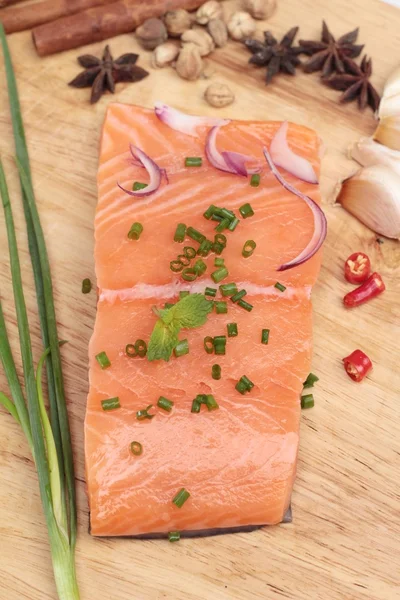 Fresh raw salmon fillet on wood background. — Stock Photo, Image