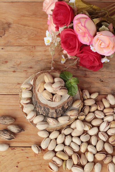 Pistachios is delicious for healthy on wood background