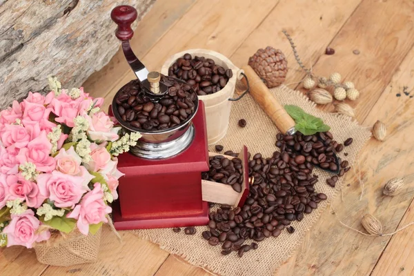 Coffee grinder with coffee beans and cup espresso — Stock Photo, Image