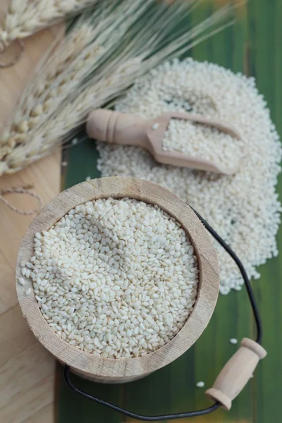 Sesame seeds for health on wood background. — Stock Photo, Image