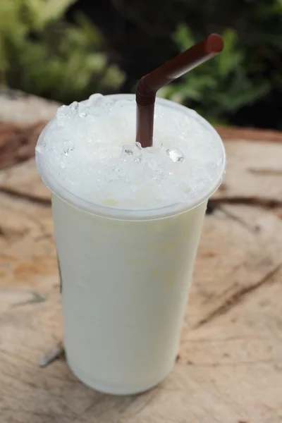 Iced milk is delicious on wood background. — Stock Photo, Image