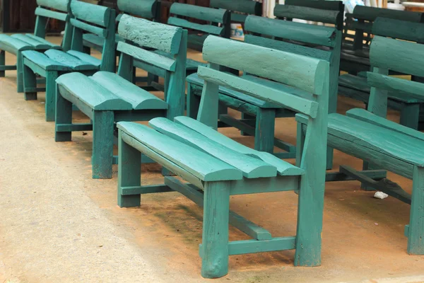 Wood bench green a lot — Stock Photo, Image