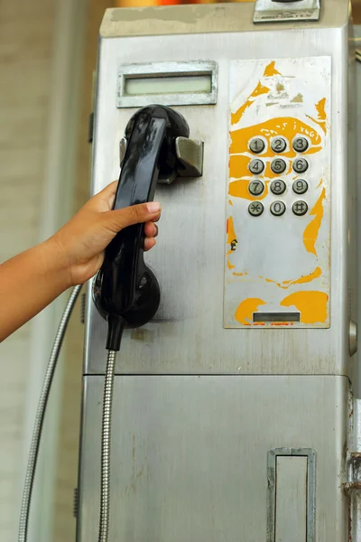 Hand  and old vintage phone booth. — Stock Photo, Image