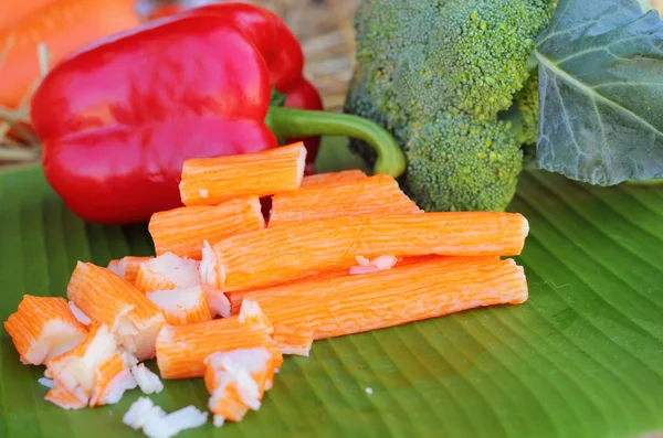 Crab sticks with fruits and vegetables — Stock Image Crab sticks with fruits and vegetables Royalty Free Stock Images