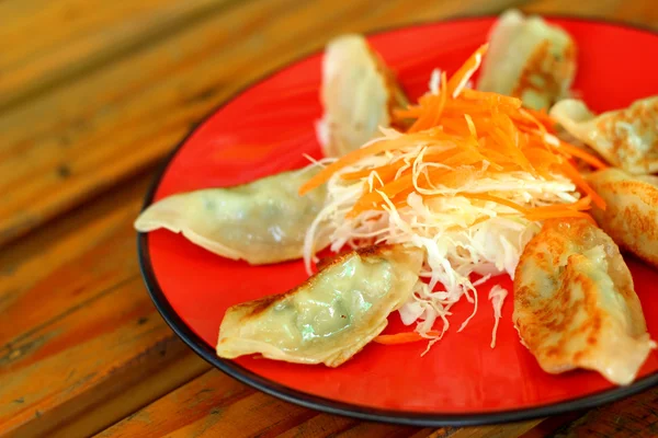 Fried Gyoza at plate - Japanese food. — Stockfoto