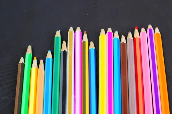 Colorful pencils on black background — Stock Photo, Image