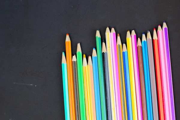 Colorful pencils on black background — Stock Photo, Image