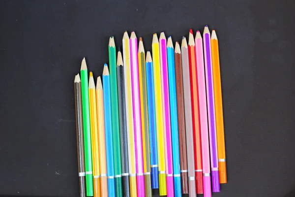 Colorful pencils on black background — Stock Photo, Image