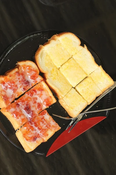 Bread, butter and strawberry jam — Stock Photo, Image