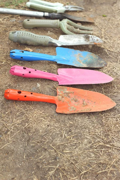 Shovel and fork for gardening on soil background — Stock Photo, Image