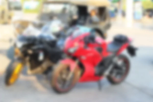 Blurred of motorcycles wheels parked on the street. — Stock Photo, Image