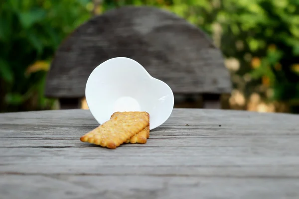 Tasty of crackers on wood table — Stock Photo, Image