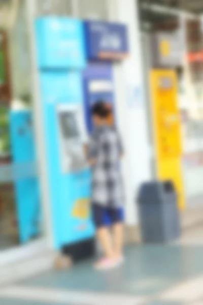 Mujer borrosa en el cajero automático —  Fotos de Stock
