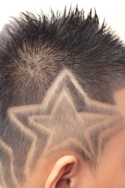 The boy's haircut with clipper and razor in the barber shop — Stock Photo, Image