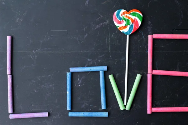 Rams chalk colorful "love" and candy heart. — Stock Photo, Image