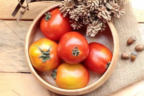 Fresh tomato on wood background — Stock Photo, Image