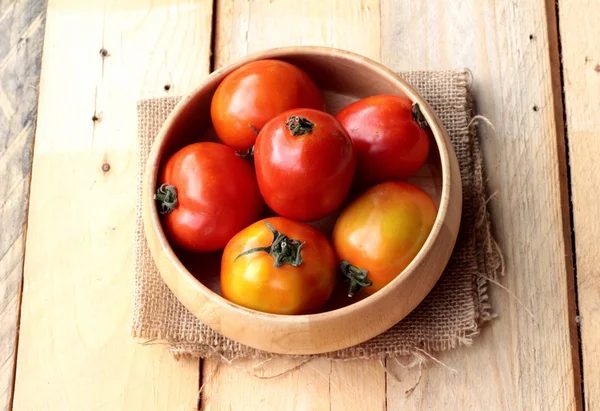 Fresh tomato on wood background — Stock Photo, Image