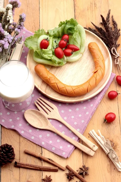 Breakfast with  sausage, salad vegetables and milk. — Stock Photo, Image