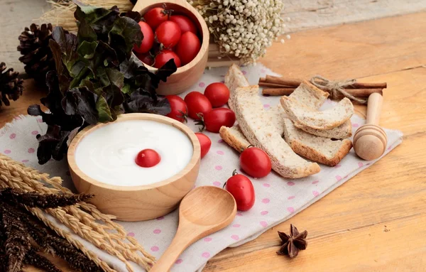 White yogurt and fresh cherry tomatoes — Stock Photo, Image