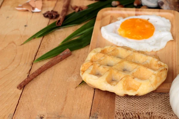 Sweet waffles and fresh milk with jam and egg heart. — Stock Photo, Image