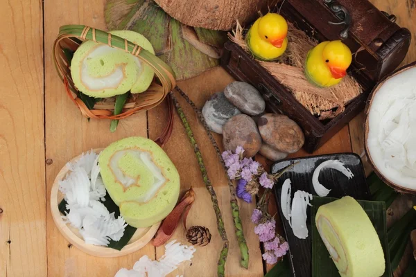 Green cake rolls filled with coconut. — Stock Photo, Image