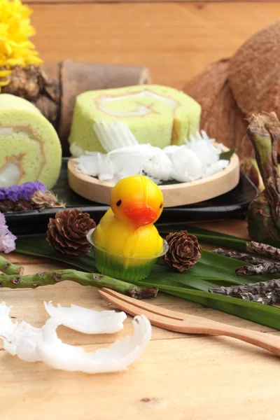 Green cake rolls filled with coconut. — Stock Photo, Image