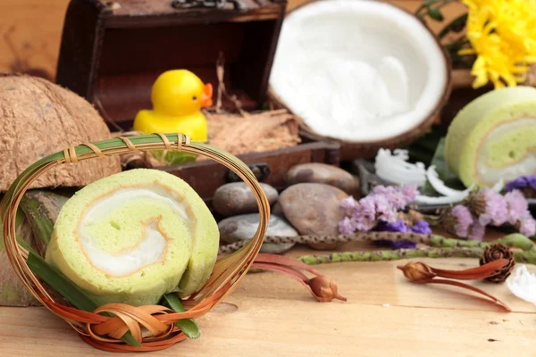 Green cake rolls filled with coconut. — Stock Photo, Image