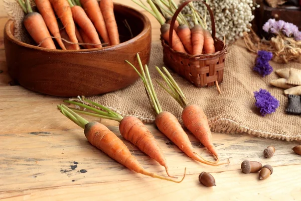 Fresh carrots on the wood background — Stock Photo, Image