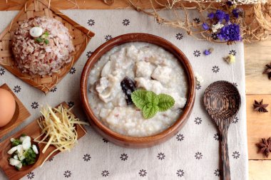 Brown rice porridge put pork and brown rice with soft-boiled egg clipart