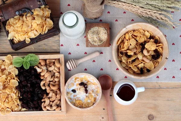 Corn flake with currant dried fruit ,cashew nuts and milk.