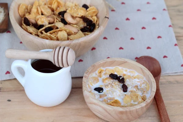 Corn flake with currant dried fruit ,cashew nuts and milk. — Stock Photo, Image