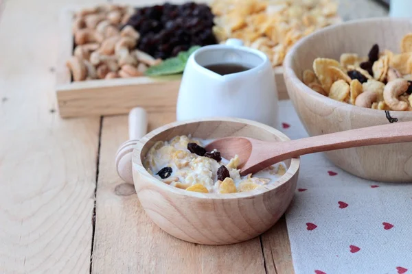 Corn flake with currant dried fruit ,cashew nuts and milk. — Stock Photo, Image