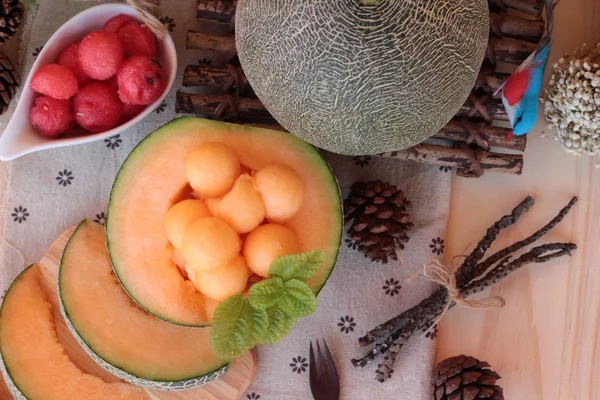 Orange cantaloupe melon fruit juicy on wood background. — Stock Photo, Image