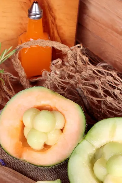 Cantaloupe melon fruit juicy on wood background. — Stock Photo, Image