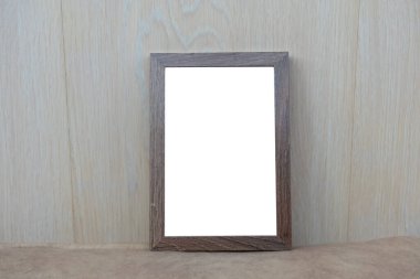 Bej duvardaki ahşap çerçeve. Ofis ya da iç mekan. Boşluğu kopyala, moc up