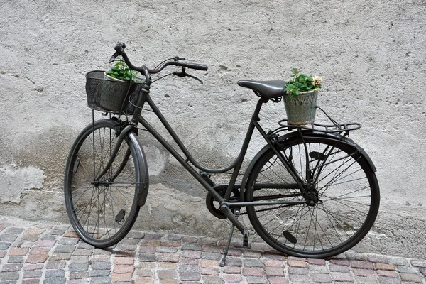 bicycle as street furniture in the historic center of Chiusa Alto Adige Italy