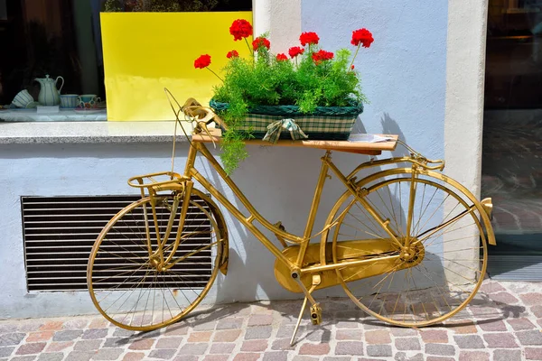 bicycle as street furniture in the historic center of Chiusa Alto Adige Italy