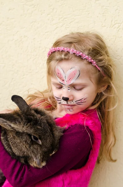 Kid with face painting and rabbit animal — Stock Photo, Image