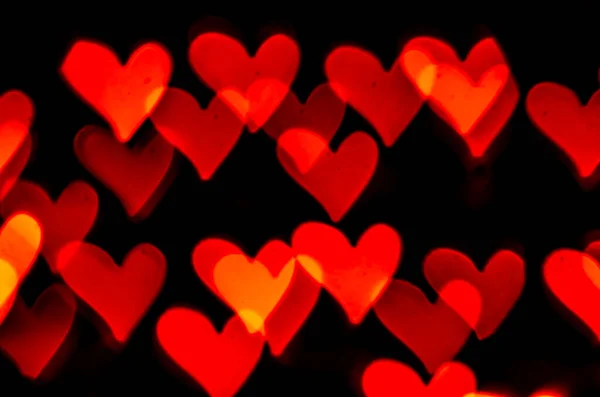 Red Heart Shape Bokeh Black Background — Stock Photo, Image