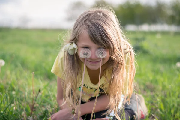 Adorable Girl Long Blond Hair Making Faces Dandelion Flowers Green — Stock Photo, Image