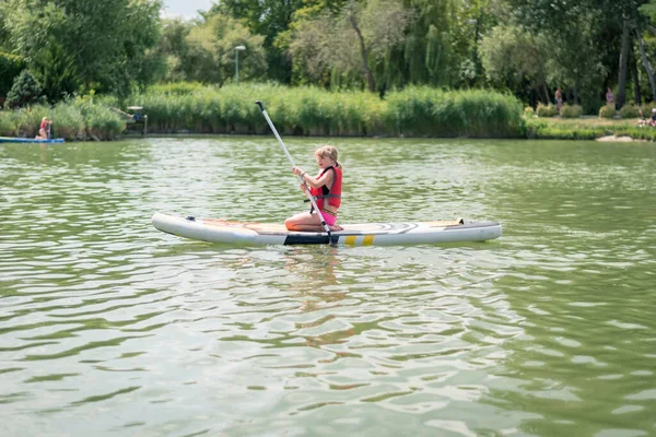 Young Girl Red Safety Inflatable Vest Paddling Paddle Board Water — Stock Photo, Image