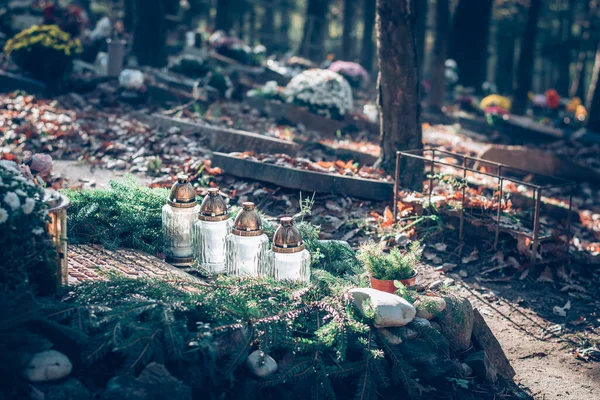 All Saints Day atmosphere in autumn in cemetery, funeral concept