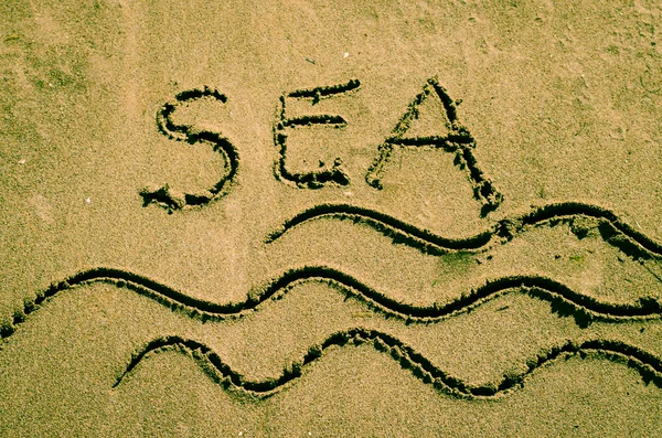Parole di mare disegnate nella sabbia — Foto Stock