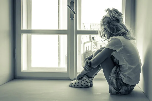 Girl sitting alone — Stock Photo, Image