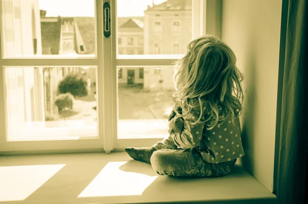 Girl sitting alone — Stock Photo, Image