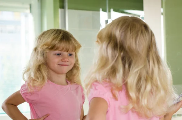 Reflection of girl in the mirror — Stock Photo, Image